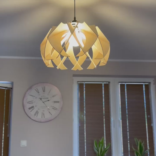 Short video showcasing different views of handcrafted large wooden pendant lamps with a modern flower-like design, highlighting the intricate craftsmanship, eco-friendly materials, and the beautiful light patterns it create.