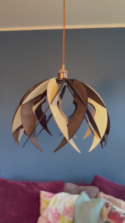 Short video showcasing different views of the handcrafted medium wooden pendant lamp with an art deco-inspired design. The video highlights the unique silhouette, eco-friendly materials, and the modern aesthetics.